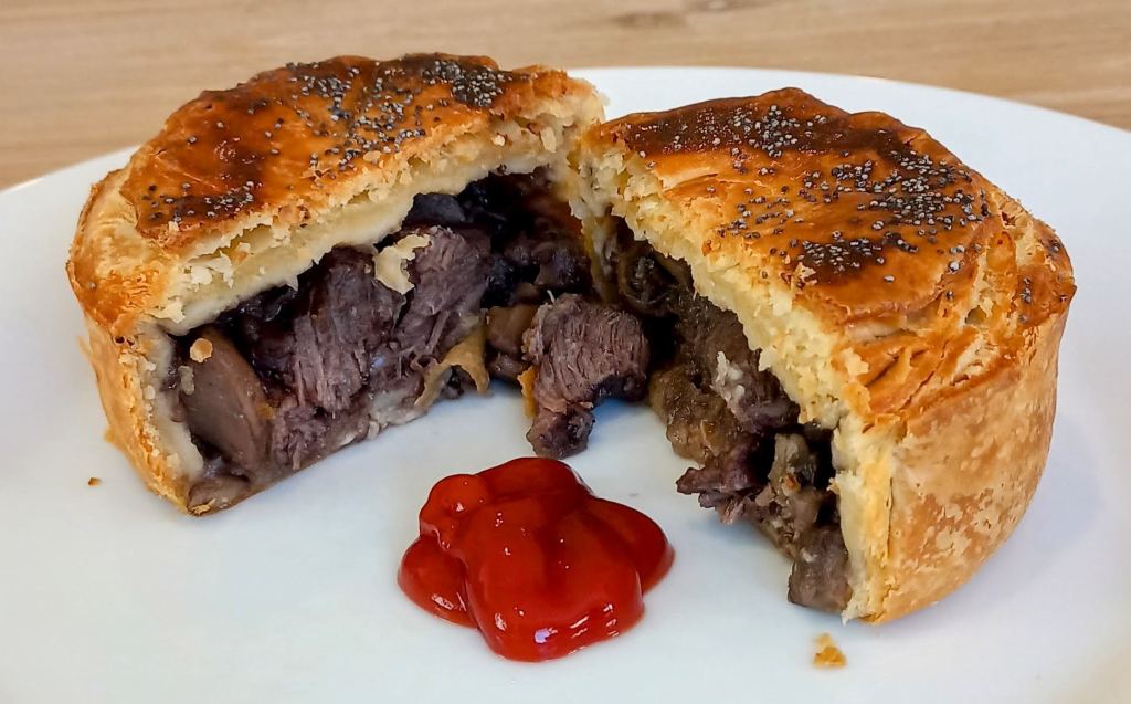 Steak and mushroom pie with tomato sauce